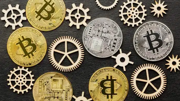 Moedas de bitcoin em meio a engrenagens mineração Paraguai roubo